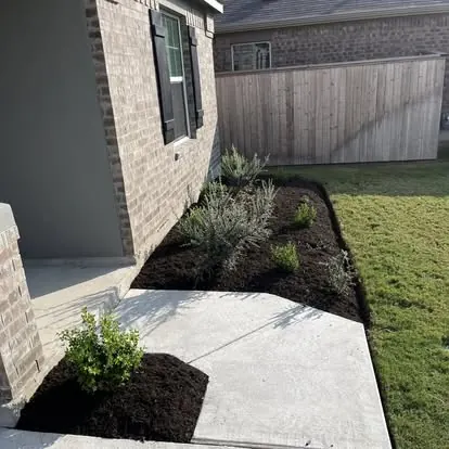 Side yard bed with fresh mulch and new plants